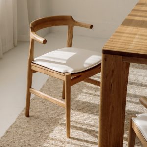 tuck in dining chair with white cushion, stained oak